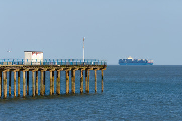 cargo ship and pier on the sea