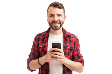 Smiling Man Holding Cell Phone