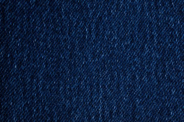 Dark blue jeans fabric texture, surface close up background