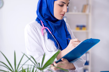 Arab female doctor working in the clinic