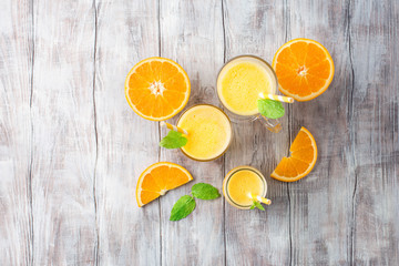 Detox diet concept: orange smoothie on table