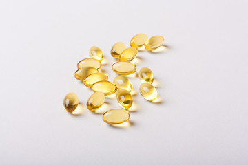 Fish oil capsules (omega 3) on a white background