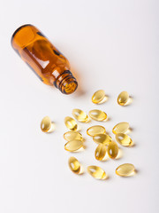 Fish oil capsules (omega 3) on a white background