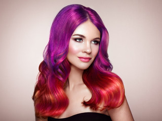 Beauty Fashion Model Woman with Colorful Dyed Hair. Girl with Perfect Makeup and Hairstyle. Model with Perfect Healthy Dyed Hair. Care and Beauty Hair Products