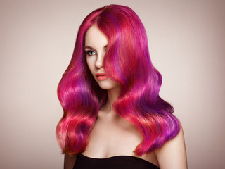 Beauty Fashion Model Woman with Colorful Dyed Hair. Girl with Perfect Makeup and Hairstyle. Model with Perfect Healthy Dyed Hair. Care and Beauty Hair Products