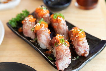 Japanese sushi food,close up of sashimi sushi set on a table in a restaurant