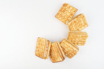 Belgian waffles on a white background. Waffles lined in a semicircle.
