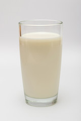 glass of milk on a white background