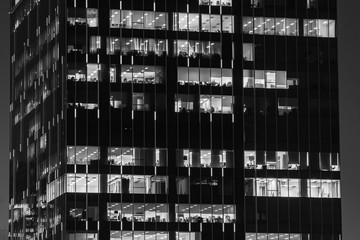 Office in the building night time. Black and white.