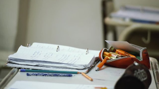 Student's Desk With Open Folder. Zoom In. 