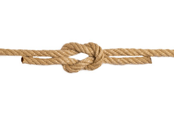 Rope isolated. Macro of figure cross node or knot from two brown ropes isolated on a white...