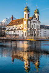 The Jesuit Church of Lucern with Mount Pilatus in the background, Central Switzerland.