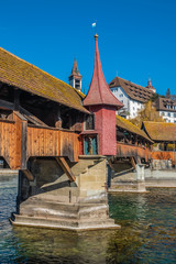 The Spreuer Bridge (Spreuerbrucke, formerly Mohlenbrucke) with the Chapel Bridge (Kepellbrucke) it is one of two extant covered wooden footbridges in the city of Lucerne, Switzerland.