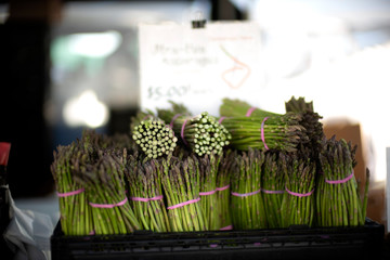 Thin green Asparagus bundles at Farmer's Market or  farmer market
