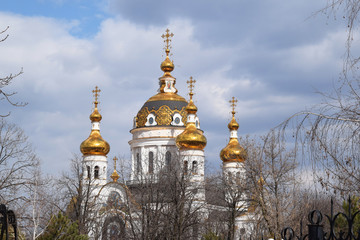 Golden domes of the Orthodox Church in the trees