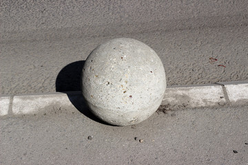 Concrete ball sphere bollard parking street pavement sidewalk