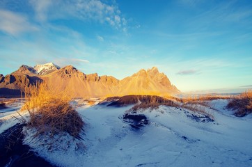 Mountains behind sand dunes in winter