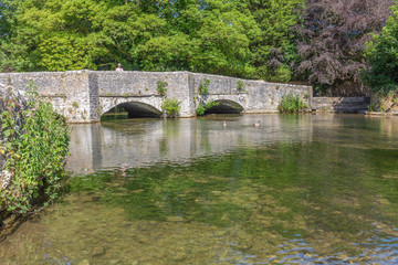 Fototapeta na wymiar Picturesque bridge over the river near the famous English town of Bakewell
