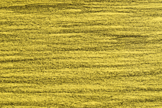black crayon lines on yellow paper background texture