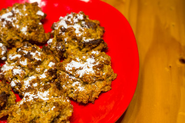 homemade oatmeal cookies with coconut, dates and powdered sugar