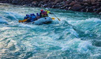 adventure water sports, white water rafting in River Ganges Rishikesh India. Raft in action image   - obrazy, fototapety, plakaty