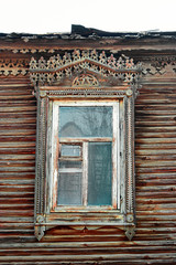 Carved window of wooden house in old russian style in Astrakhan Russia