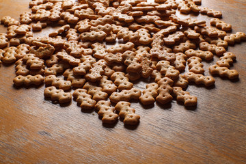 Composition of crackers with poppy seeds, spread out on a wooden background