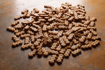 Composition of crackers with poppy seeds, spread out on a wooden background