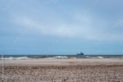 The Baltic Sea Sandy Beach With Small Stones And A Large