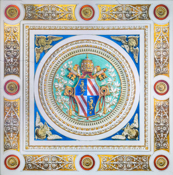 Pope Pius IX coat of arms in the ceiling of the Church of Santo Spirito dei Napoletani in Rome, Italy.