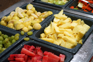 sliced tropical fruits in the buffet