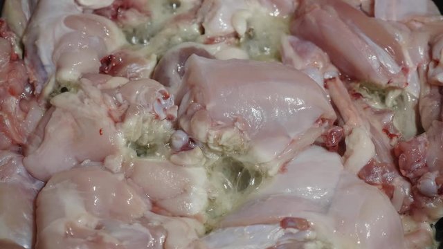 Delicious fresh rabbit meat is fried in a pan.
