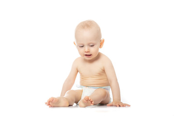 Adorable baby wearing diaper isolated on a white background. people concept