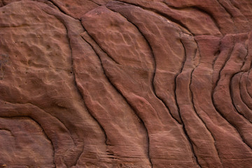 brown textured wallpaper pattern of ancient canyon rock vertical wall background
