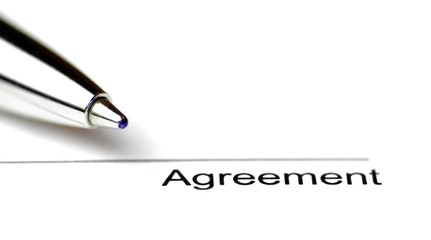 Close-up of a line for signing a contract on white paper with a pen - surface to place the signature to seal a contract in close-up