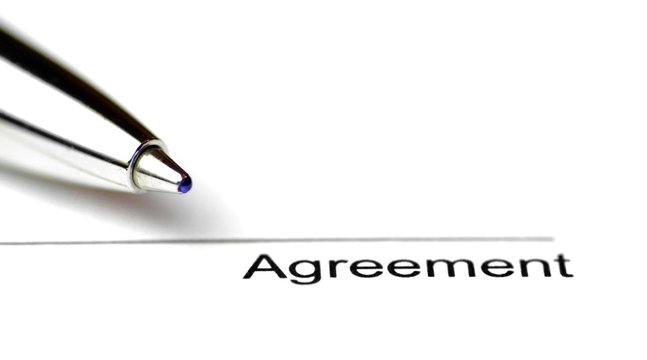 Close-up of a line for signing a contract on white paper with a pen - surface to place the signature to seal a contract in close-up