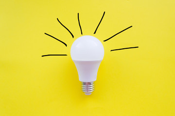 Creative light bulb concept, yellow background