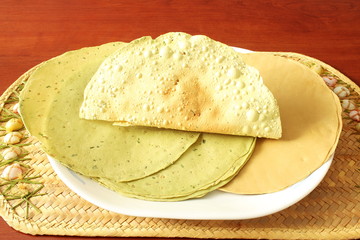 indian traditional food lunch or tea time snack papad or papadum roasted and raw dried