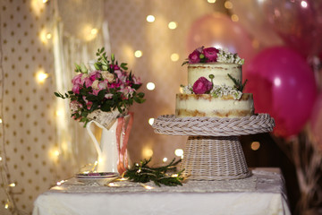 Cake and fresh flowers, festive style and wedding