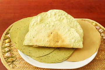 indian traditional food lunch or tea time snack papad or papadum roasted and raw dried
