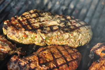 delicious pieces of fresh grilled meat with herbs