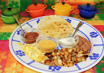 Breakfast Taco Ingredients on Large Platter in Colorful Mexico Setting