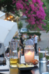 table with drinks and snacks and a candle
