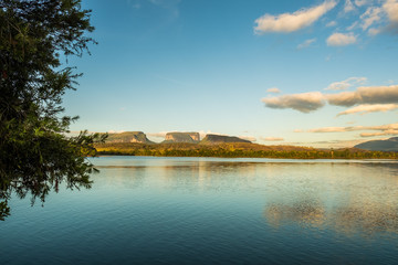 Sunrise over three small mountain in Ucaima. Canaima National Park, Venezuela.