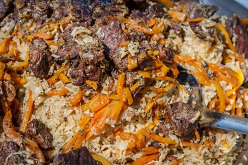 Rice pilaf, also known as plov or pilau, a national cuisine dish in Uzbekistan and other Central and South Asian countries, as well as in the Caucasus and other regions. 