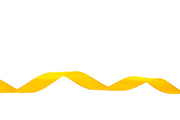 Yellow ribbon isolated on white background. Spiral of satin ribbons. Festive decor on a white background.