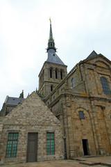 Fototapeta na wymiar Classic facade of the church-abbey Saint-Michel, Mont Saint Michel, Normandy, France