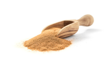 Ground ceylon cinnamon in wooden scoop