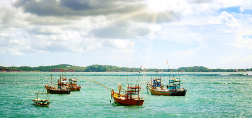 Beautiful seascape with fishing boats on the water. Sri Lanka. Wide photo.