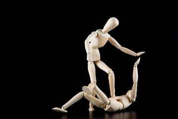 Mannequin dolls in interaction isolated on black background